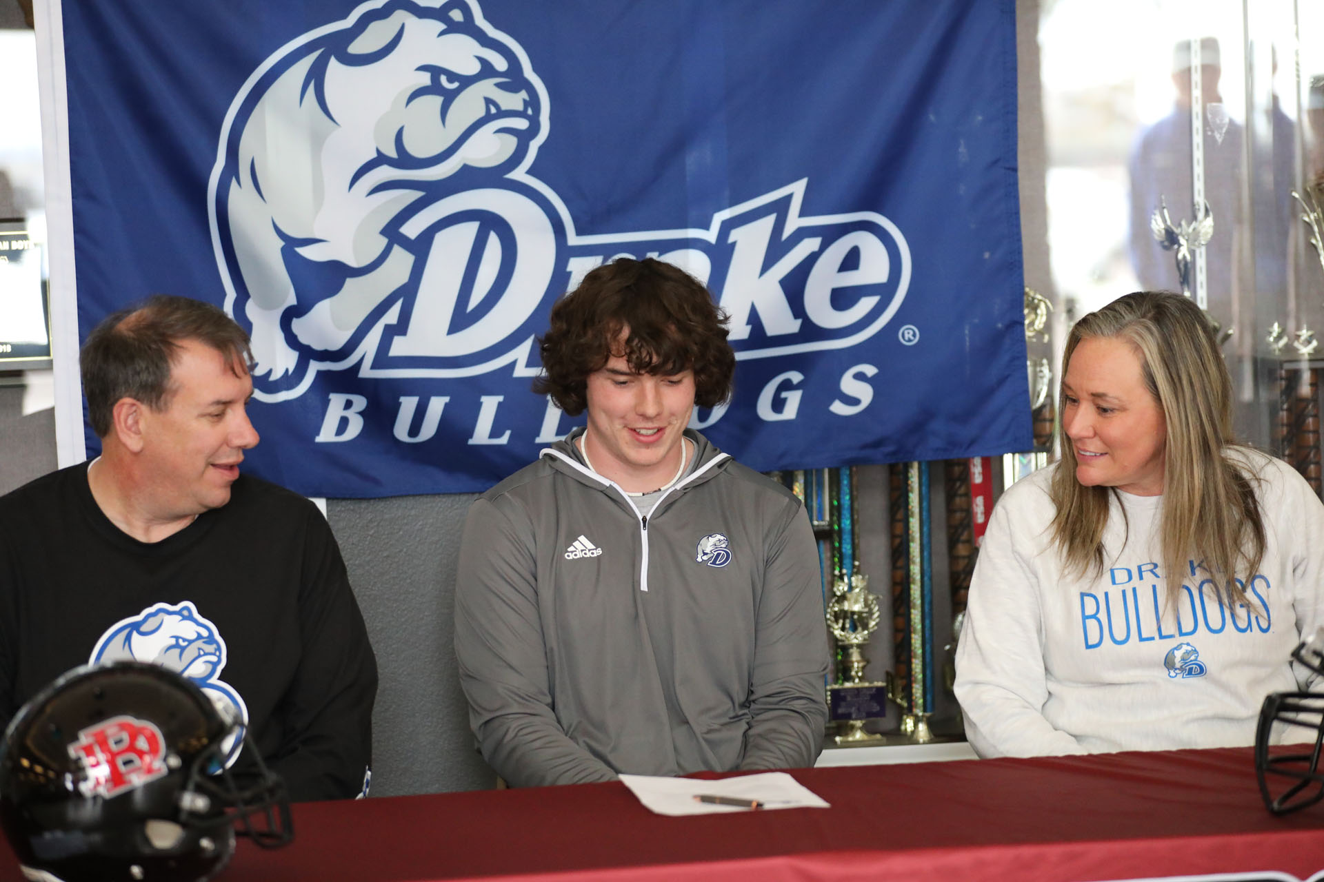 Jacob about to sign along side his parents