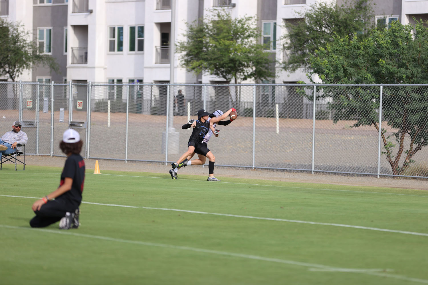 Catching the ball in the endzone and getting his feet down