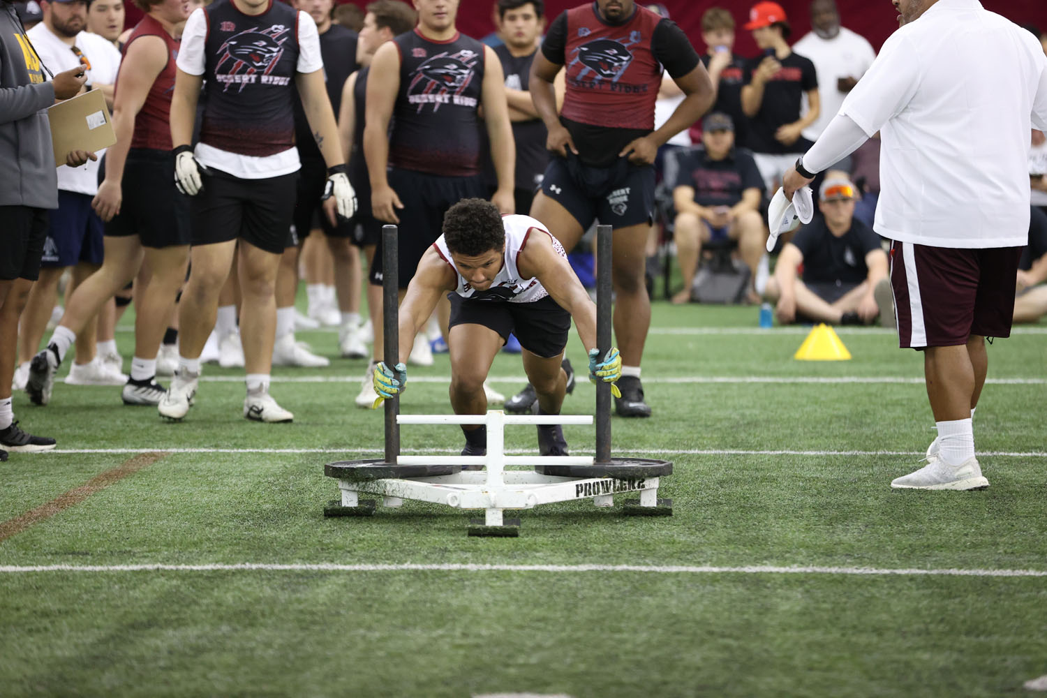 Pushing the sled down the field