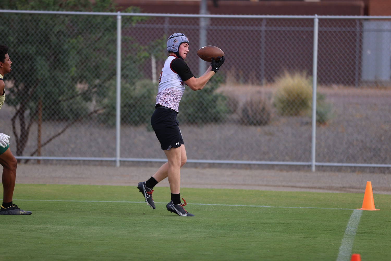 Catching the ball in the endzone for a touchdown