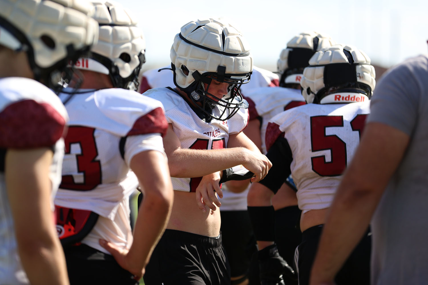 Austin looking at his wristband for the play