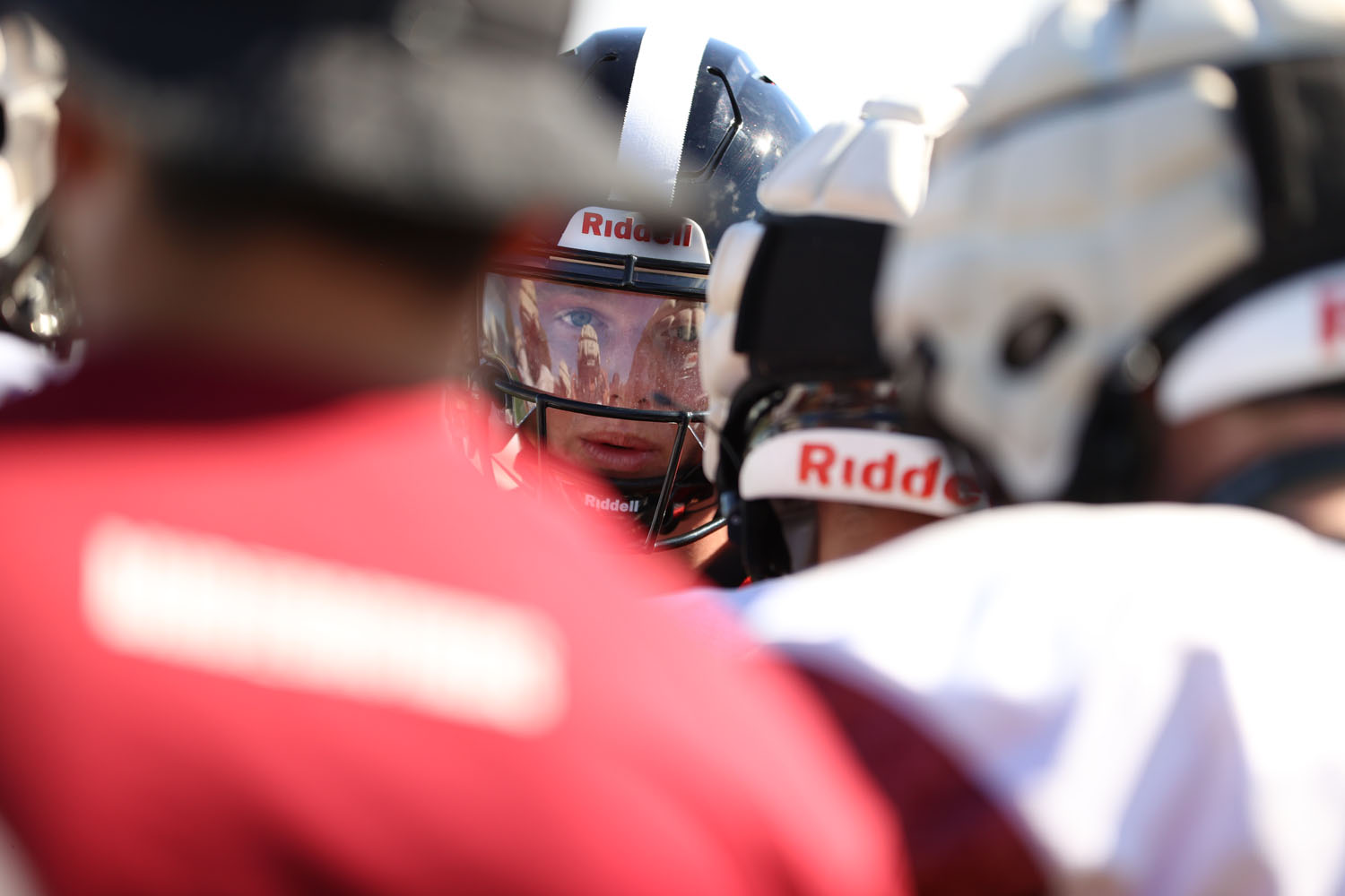 Major calling the play in the huddle