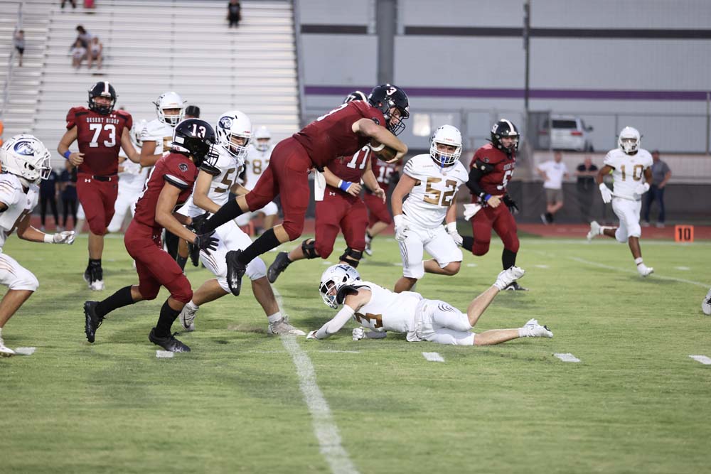 Major jumping over a tackle