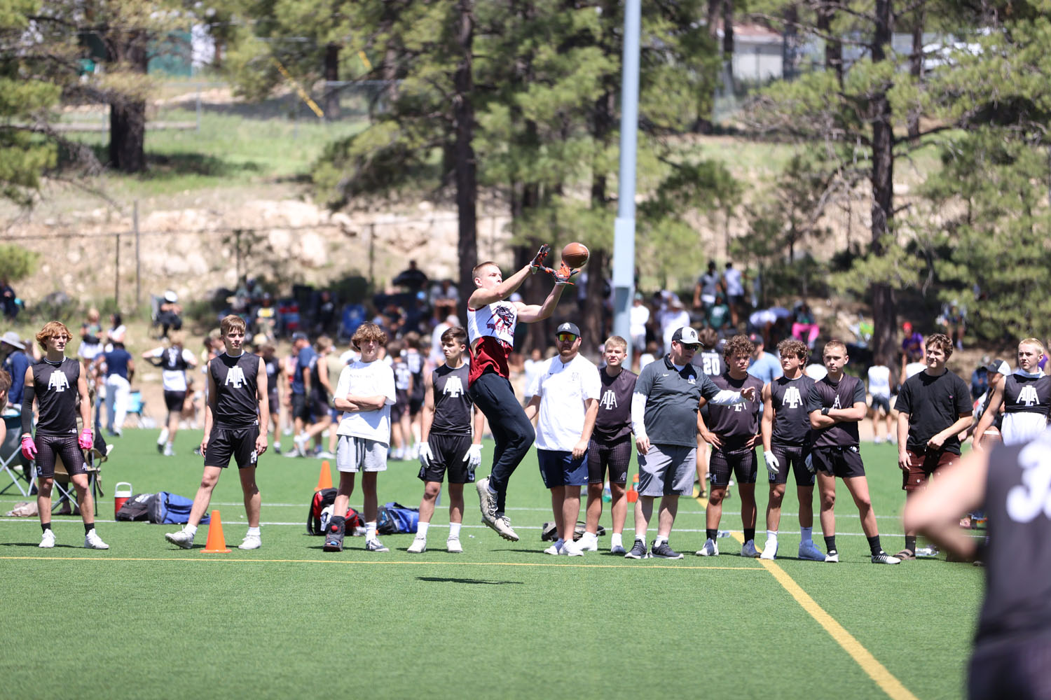 About to make a catch along the sidelines