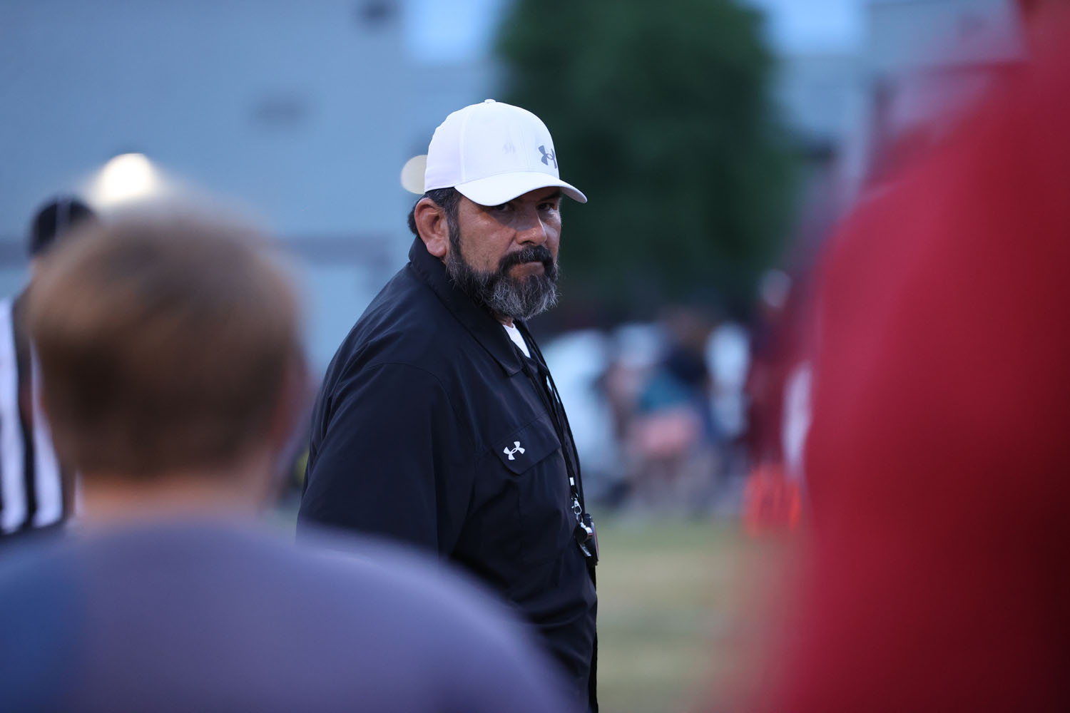 Coach Lopez talking to the team after the game