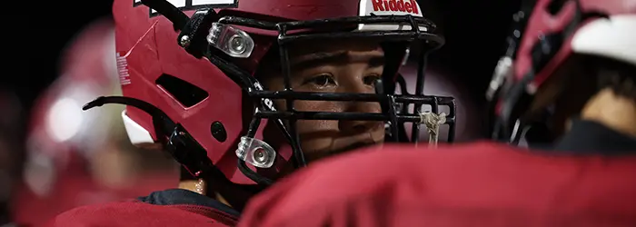 DRHS teammates talking on the sidelines